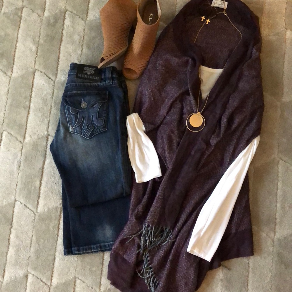 Winter outfit including jeans and fringe shawl